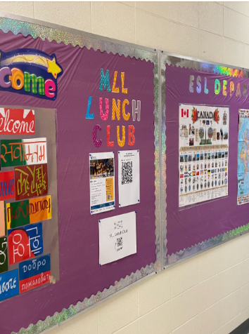 Purple bulletin board with colourful letters advertising MLL Lunch Club